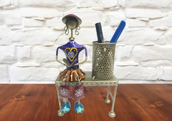 Iron Decorative  musician with hanging legs on Bench with pen Stand