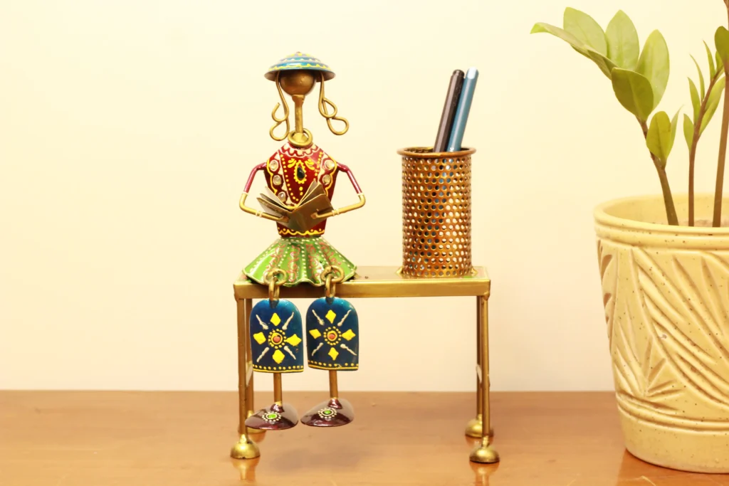 Iron Decorative musician with hanging legs on Bench with pen Stand