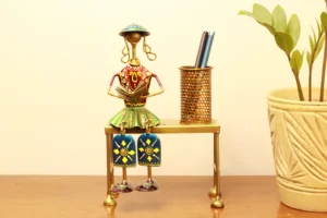 Iron Decorative  musician with hanging legs on Bench with pen Stand